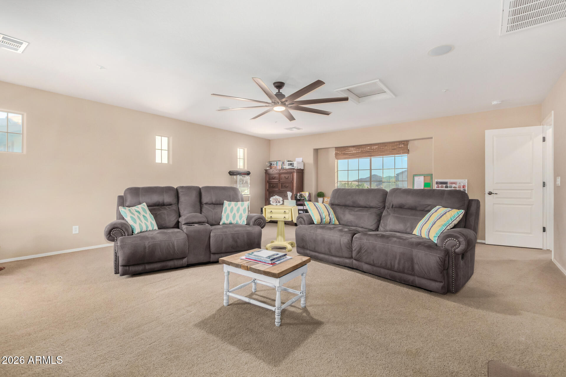 7316 West Montgomery Road Peoria, AZ 85383 - Photo 22 of 49 a living room with furniture and a ceiling fan