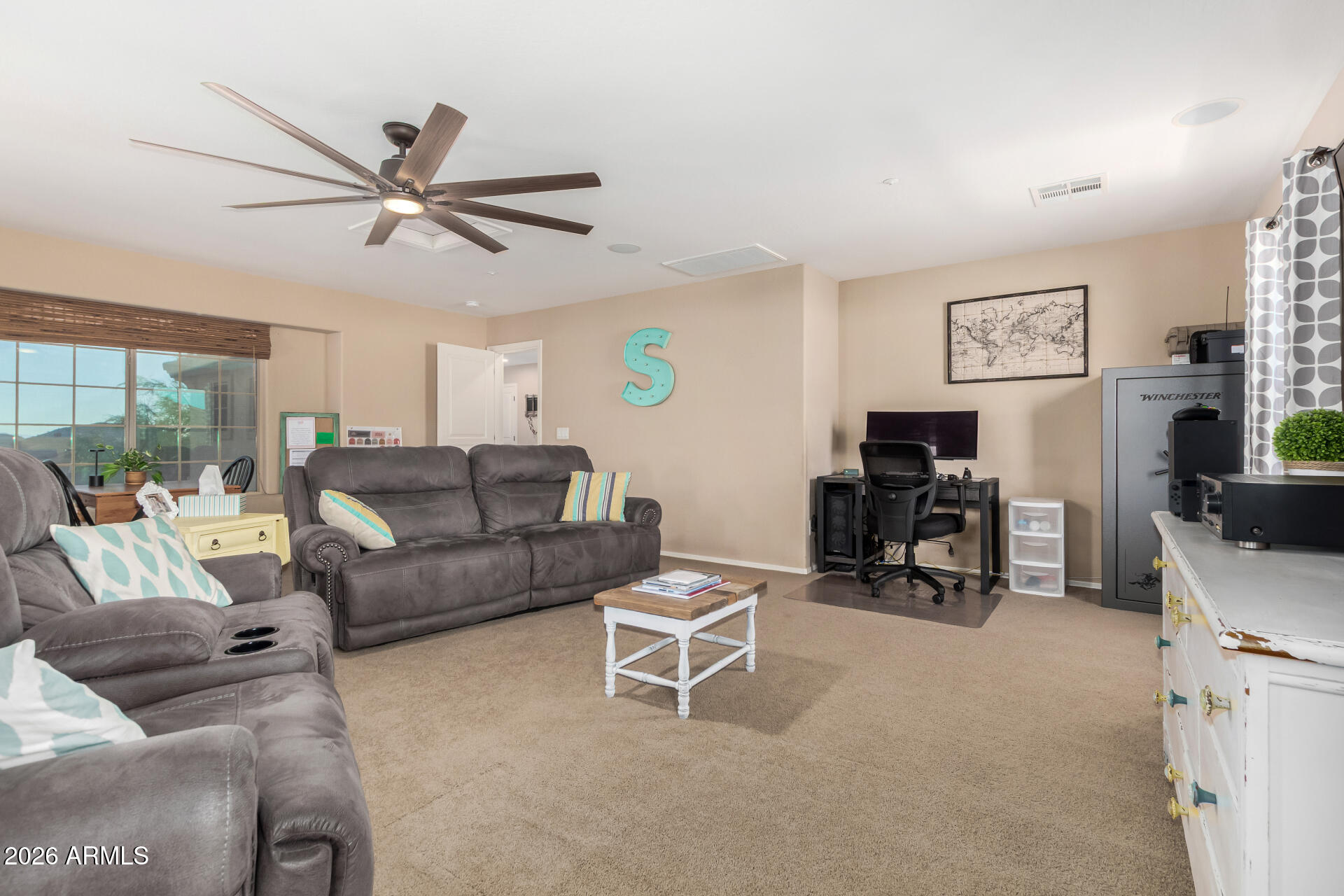 7316 West Montgomery Road Peoria, AZ 85383 - Photo 23 of 49 a living room with furniture and a flat screen tv with kitchen view