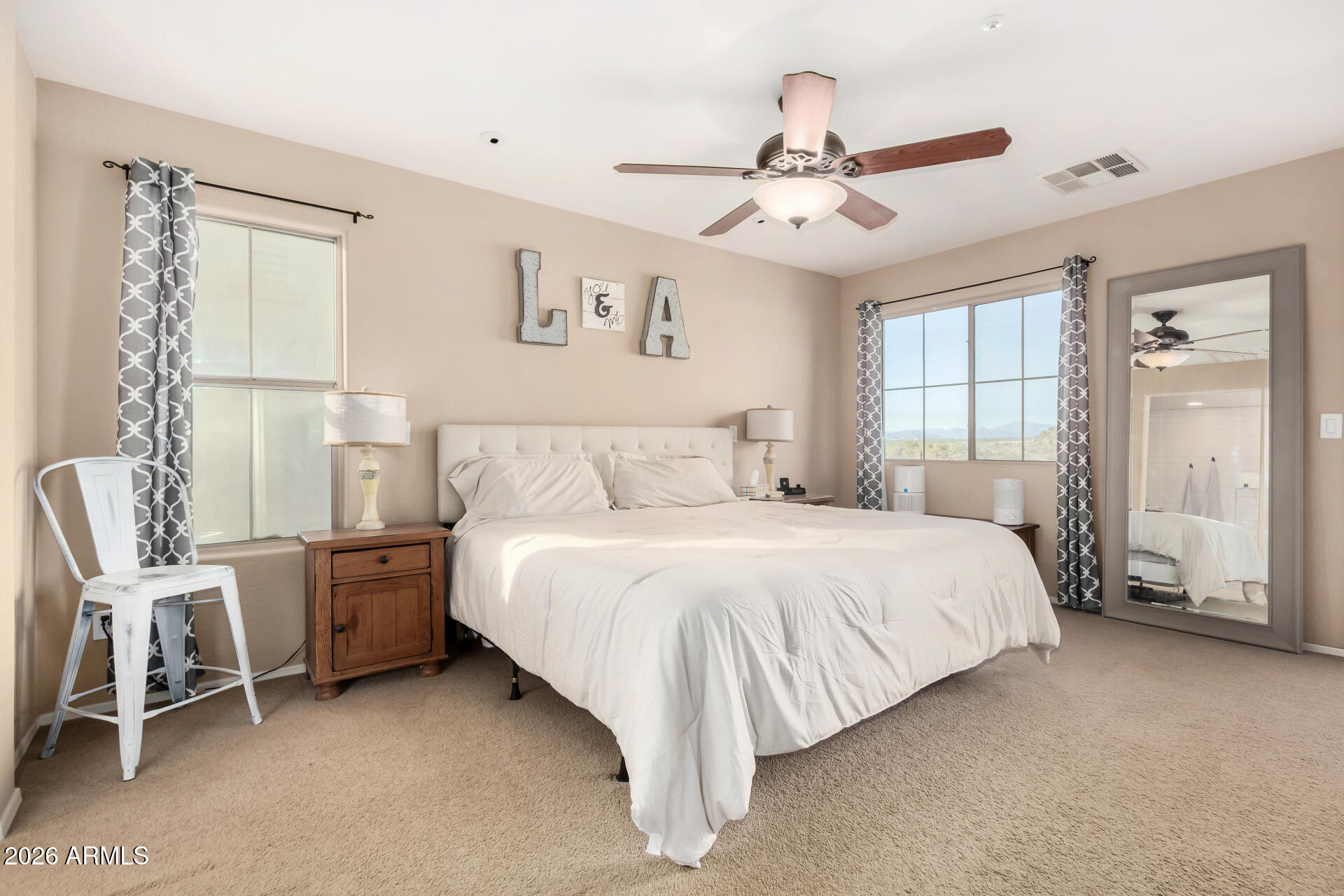 7316 West Montgomery Road Peoria, AZ 85383 - Photo 24 of 49 a bedroom with a bed and a window