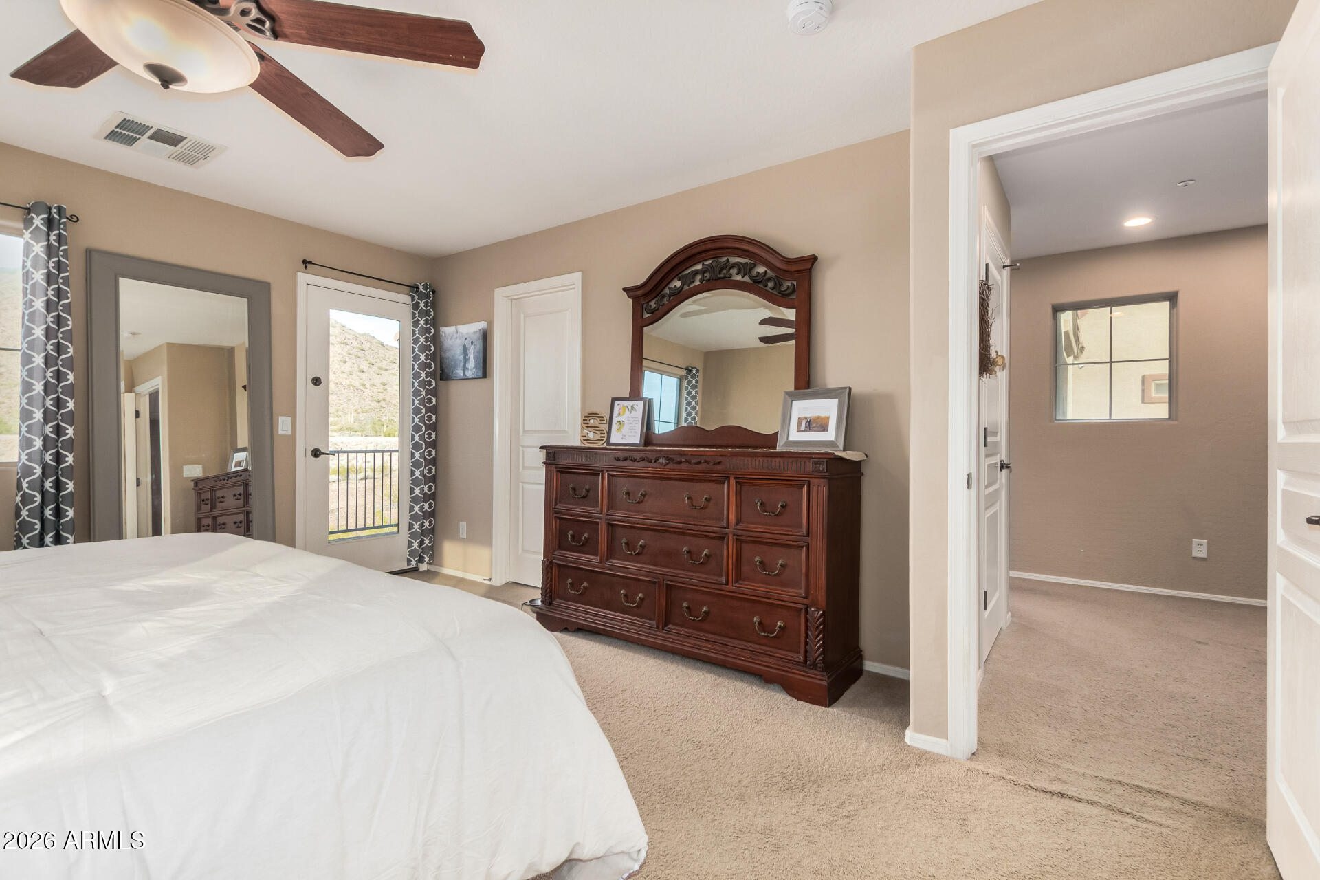 7316 West Montgomery Road Peoria, AZ 85383 - Photo 26 of 49 a bedroom with a bed and a dresser