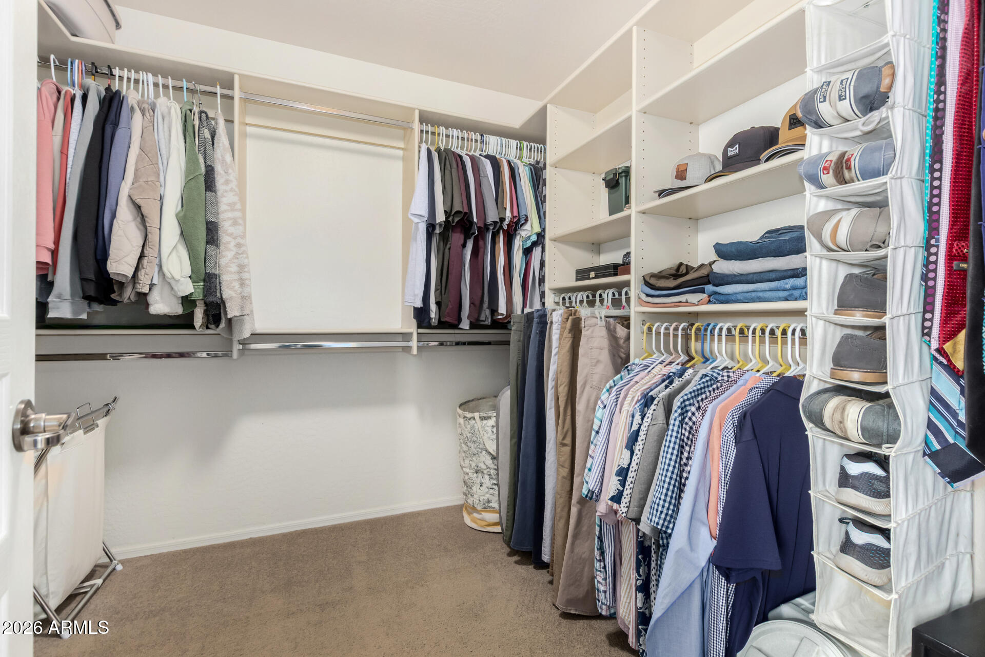 7316 West Montgomery Road Peoria, AZ 85383 - Photo 29 of 49 a view of walk in closet with clothes and shoes