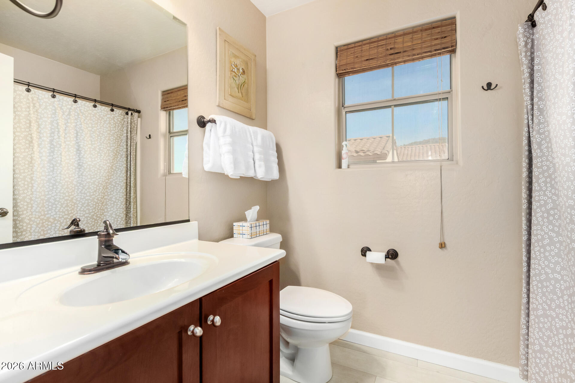 7316 West Montgomery Road Peoria, AZ 85383 - Photo 34 of 49 a bathroom with a sink toilet and shower