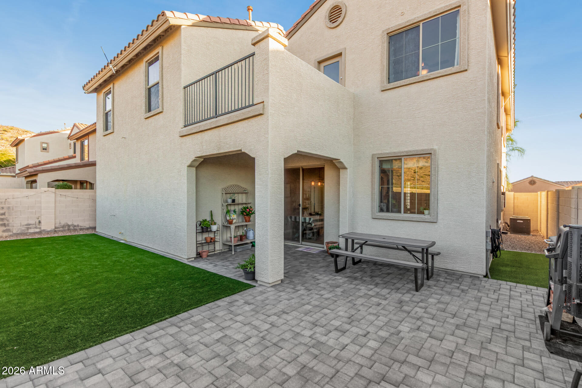 7316 West Montgomery Road Peoria, AZ 85383 - Photo 37 of 49 a front view of a house with garden