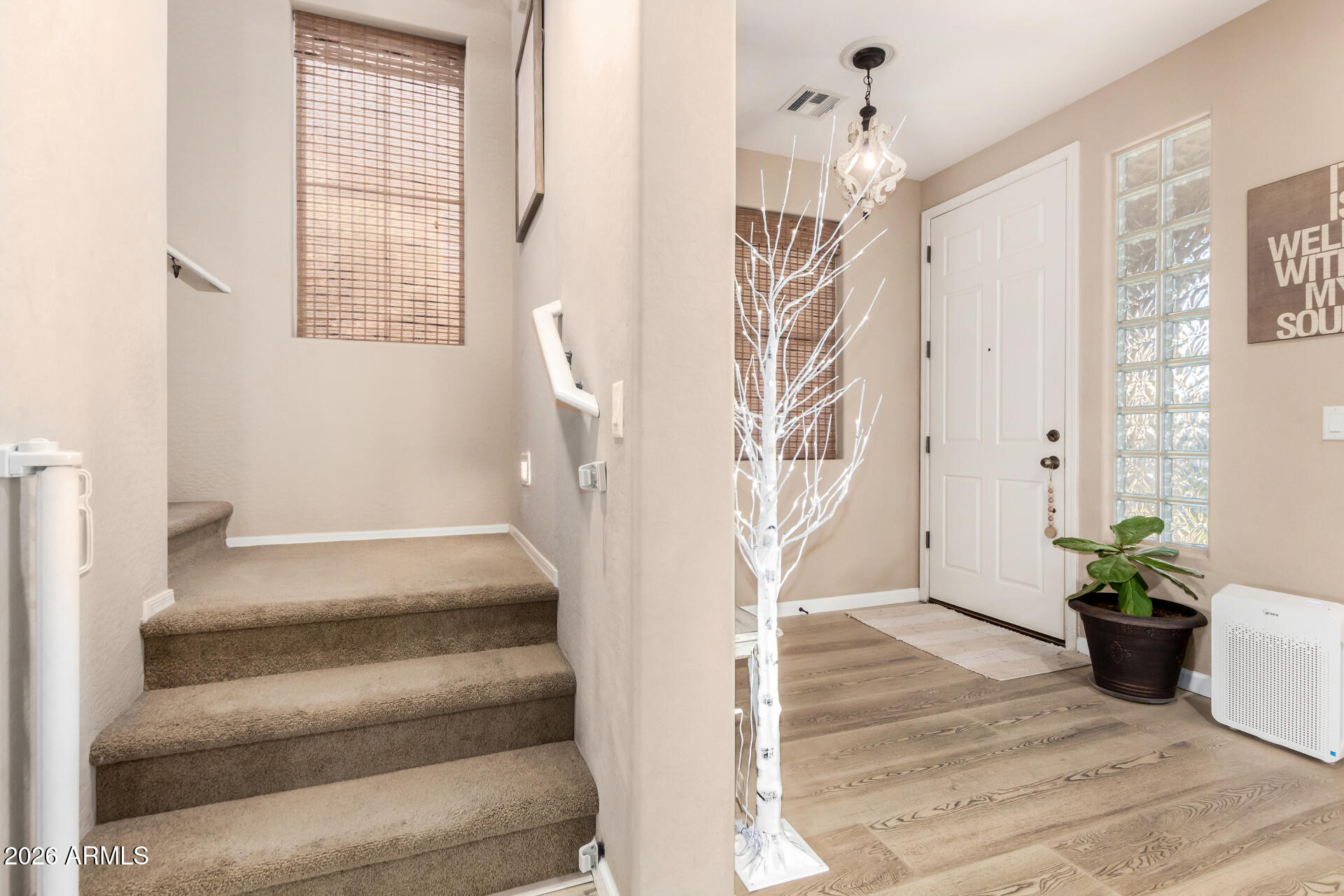 7316 West Montgomery Road Peoria, AZ 85383 - Photo 4 of 49 a view of entryway and hall with wooden floor