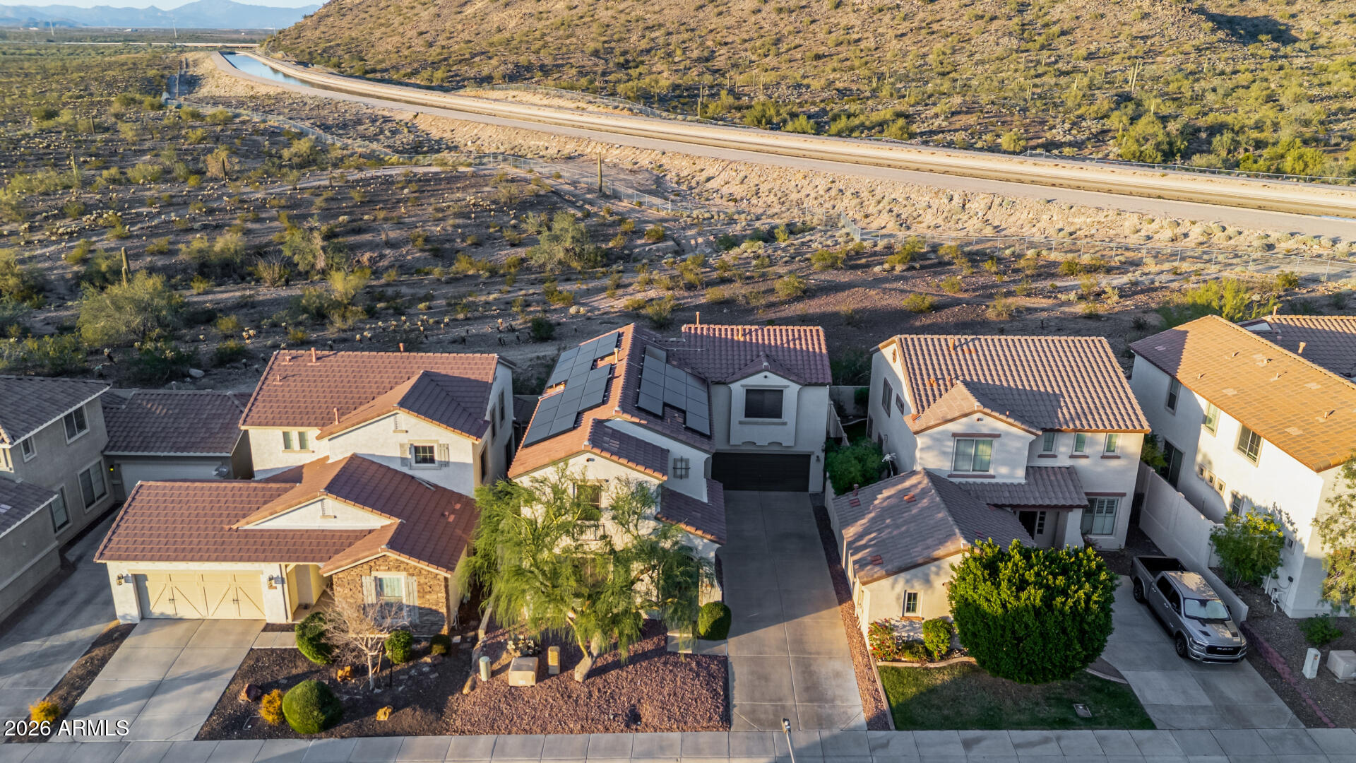 7316 West Montgomery Road Peoria, AZ 85383 - Photo 49 of 49 an aerial view of a house with a yard and lake view