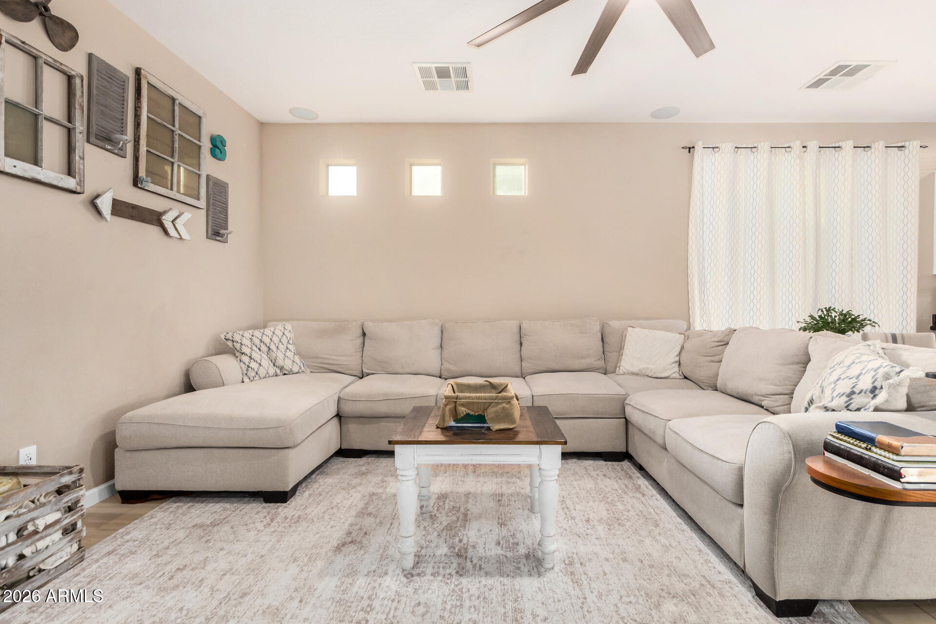 7316 West Montgomery Road Peoria, AZ 85383 - Photo 6 of 49 a living room with furniture and a couch