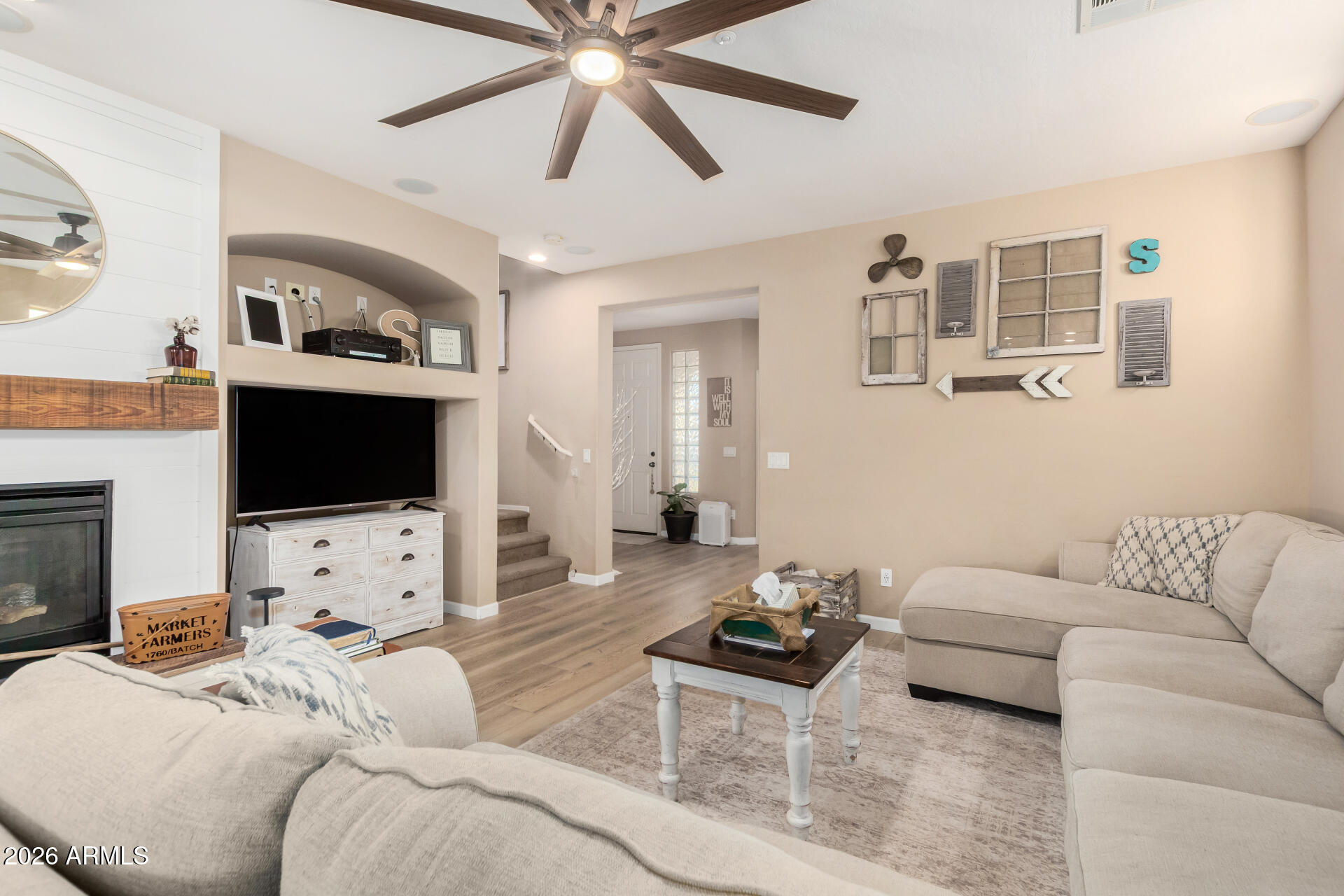 7316 West Montgomery Road Peoria, AZ 85383 - Photo 7 of 49 a living room with furniture and a flat screen tv