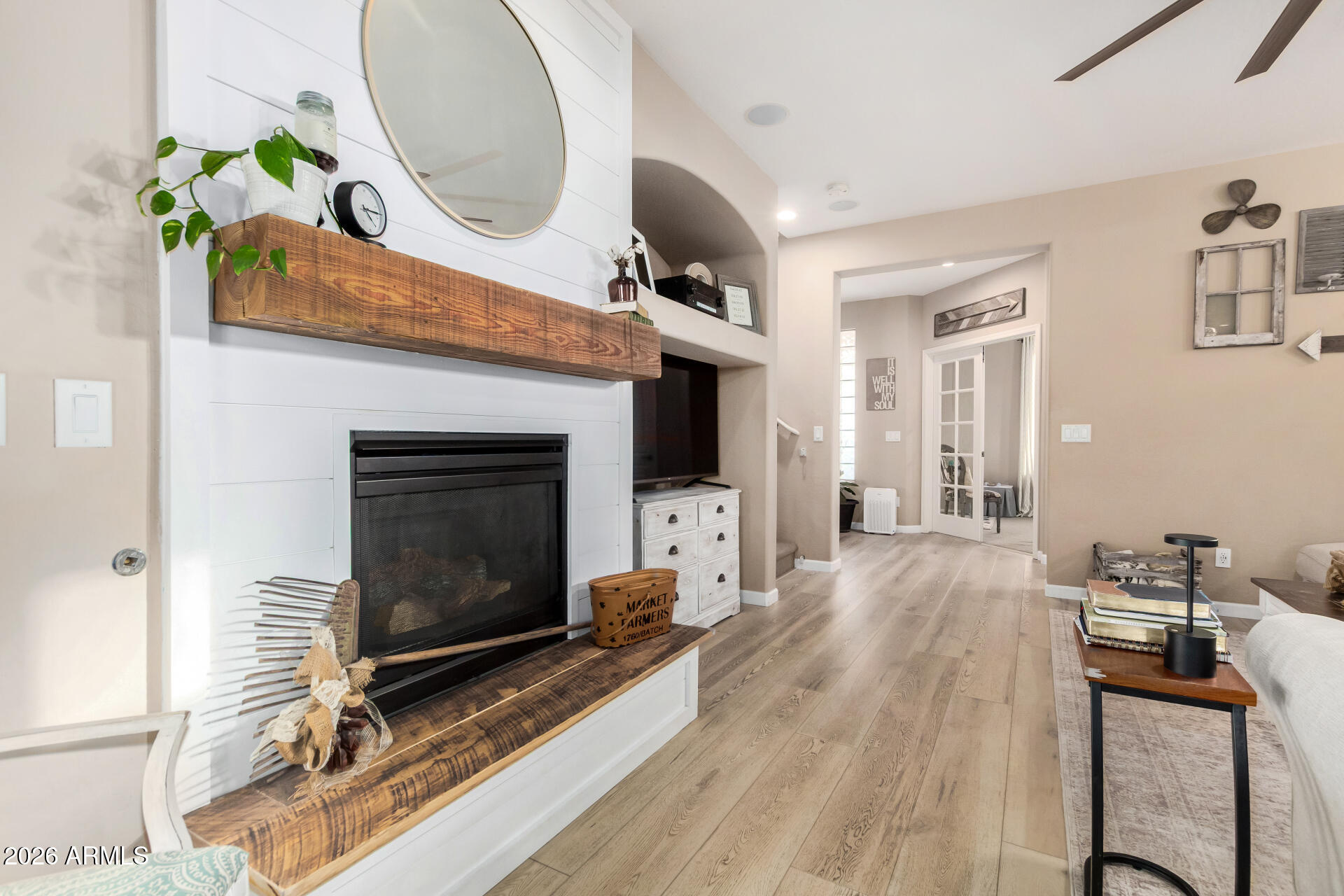 7316 West Montgomery Road Peoria, AZ 85383 - Photo 8 of 49 a living room with furniture a fireplace and a table
