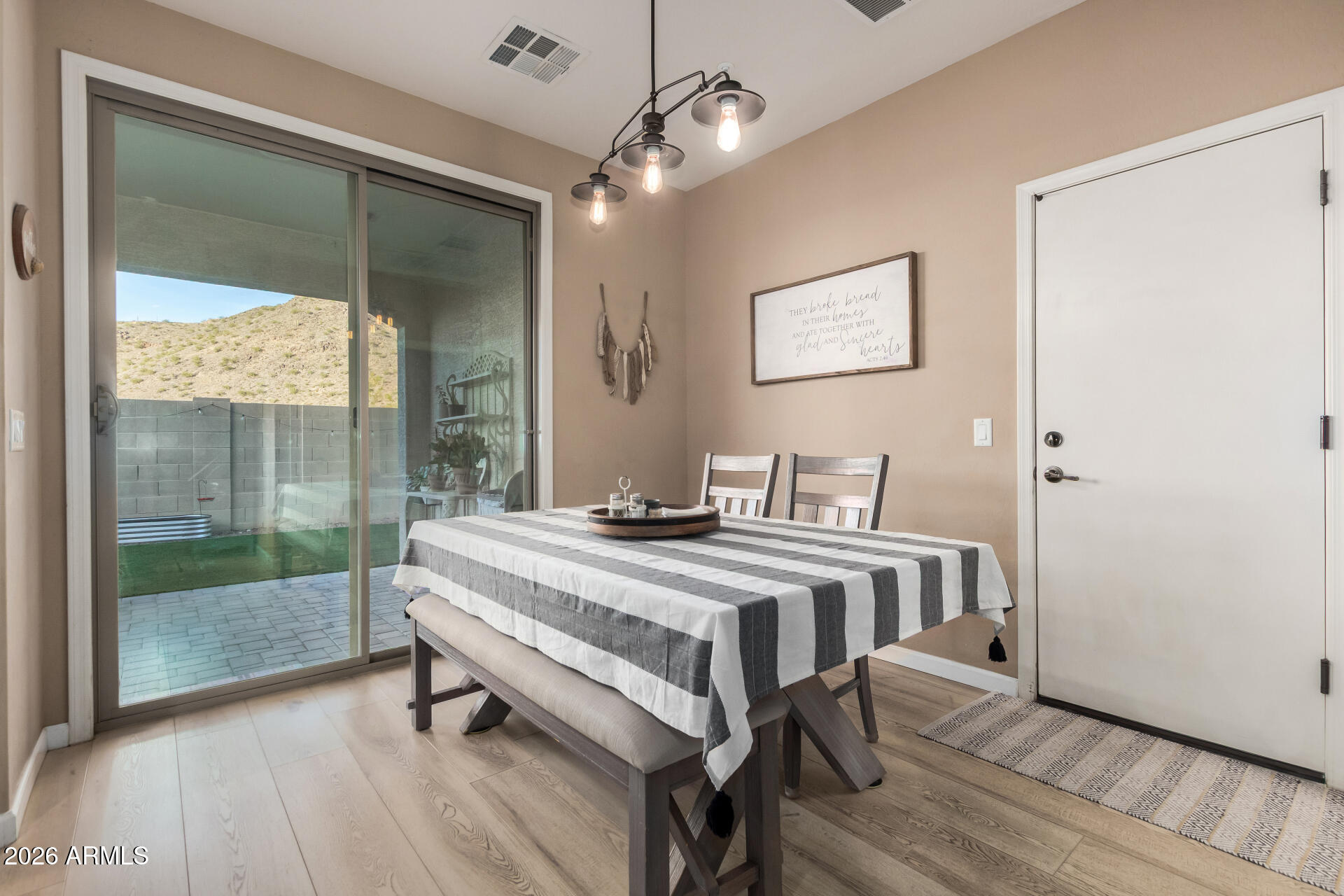 7316 West Montgomery Road Peoria, AZ 85383 - Photo 9 of 49 a spacious bedroom with a bed and a table