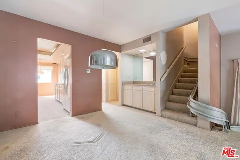 a view of a livingroom with a staircase