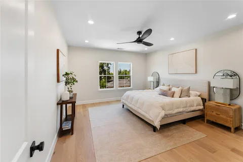 a bedroom with a bed and a chandelier