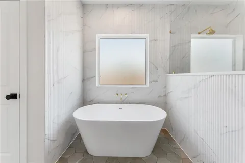 a view of room with window and wooden floor