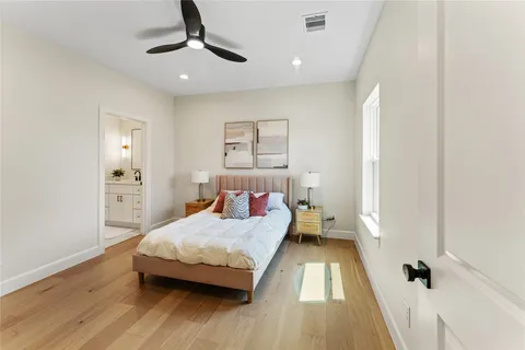 a bathroom with a double vanity sink toilet and shower