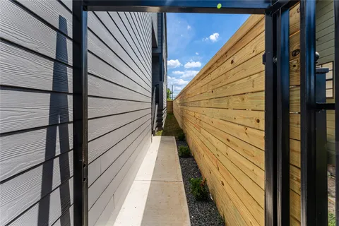 a view of balcony with wooden floor