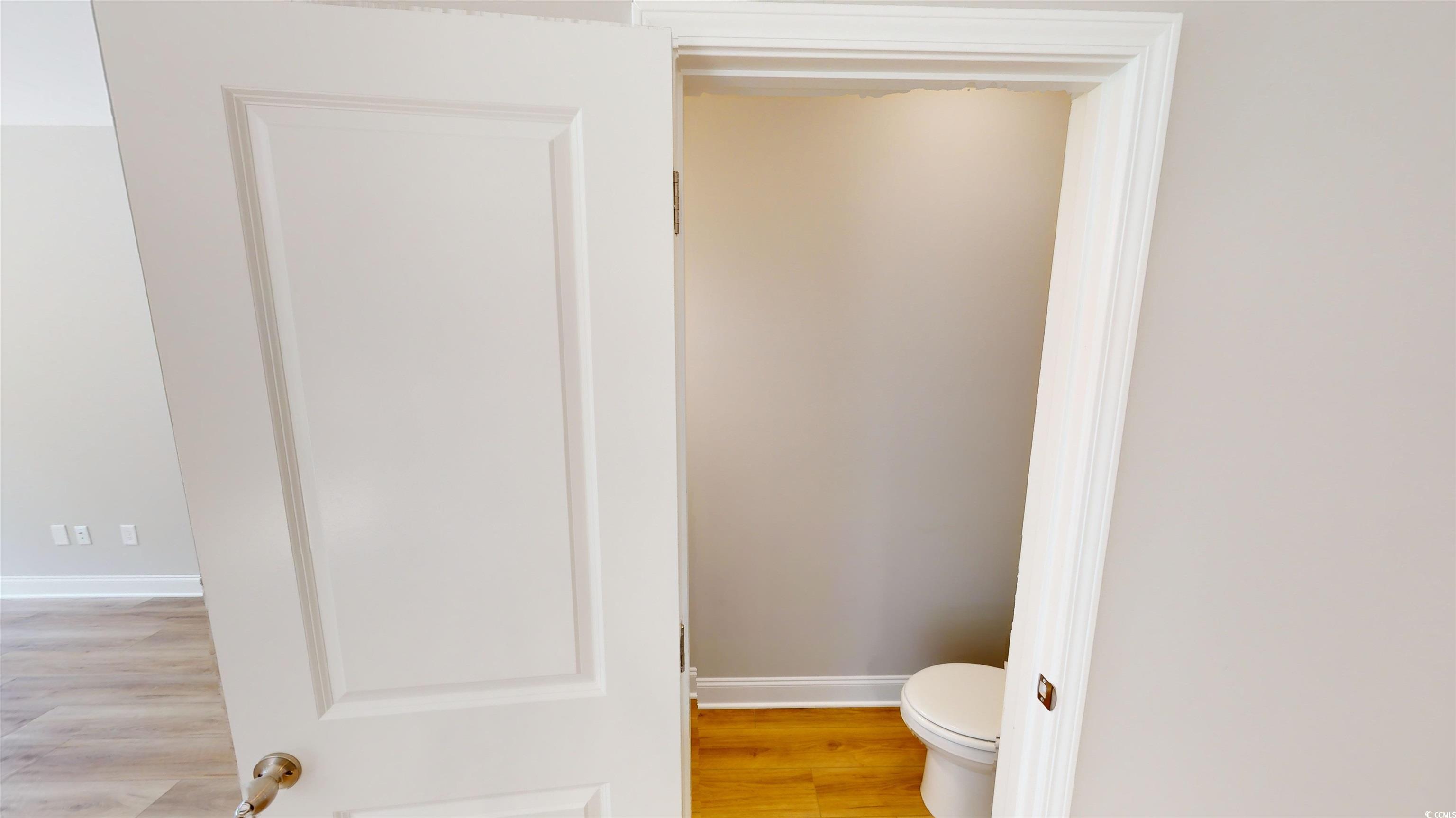 1016 Moen Loop, Unit LOT 5 Conway, SC 29526 - Photo 26 of 31 Bathroom with wood finished floors and toilet