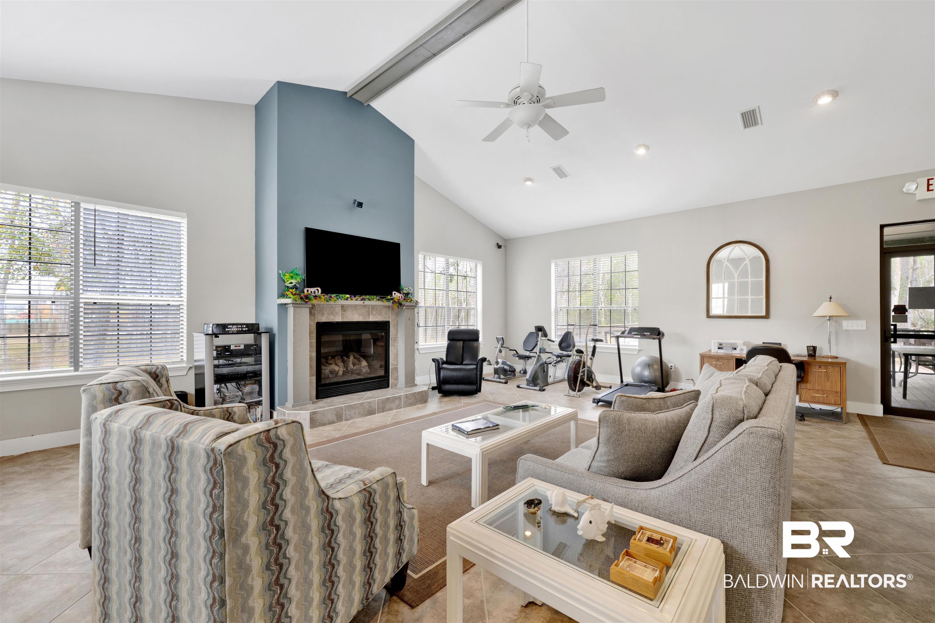 4650 Griffith Marina Road, Unit LOT 24 Orange Beach, AL 36561 - Photo 28 of 34 Living room with ceiling fan, light tile patterned floors, and a tile fireplace