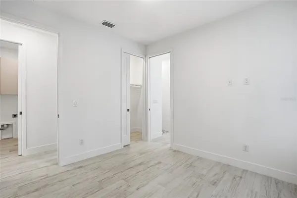 a view of a storage & utility room with two washing machine
