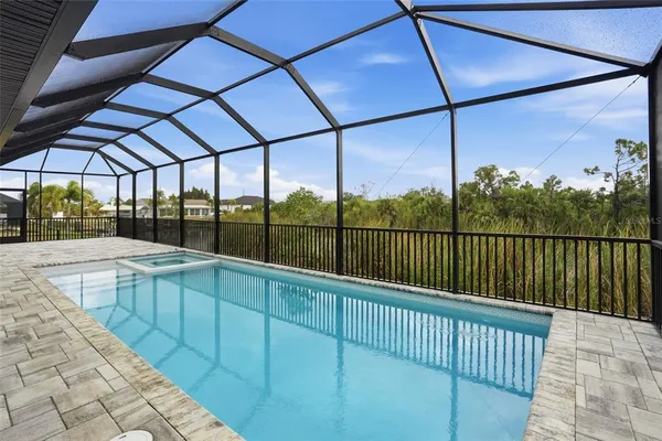 an aerial view of a residential houses with outdoor space