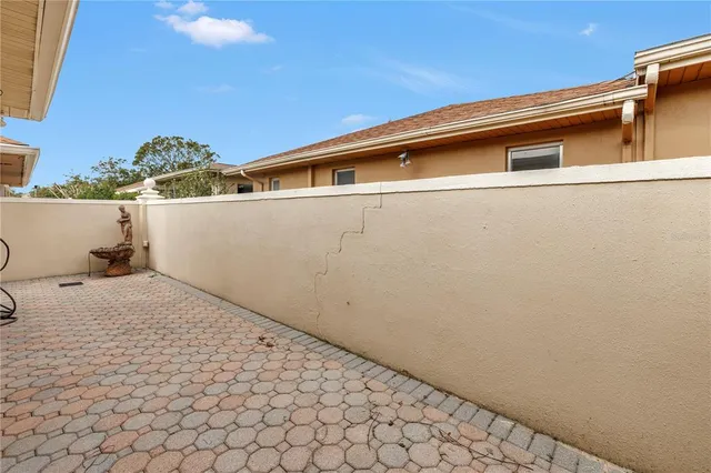 a sign that is sitting in front of flowers