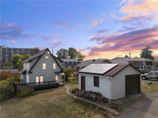 front view of a house with a fence