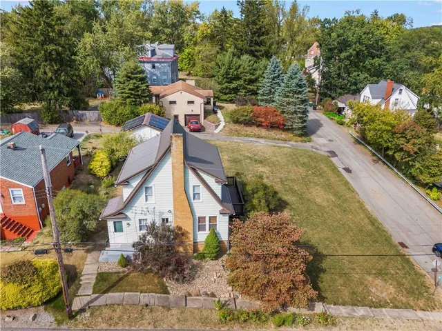 a view of residential houses with outdoor space and city view