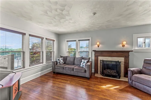 a living room with furniture and a fireplace