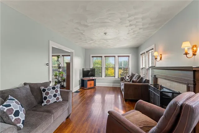 a living room with furniture or couch and a wooden floor