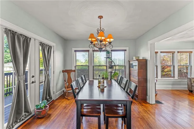 a view of a dining room with furniture window and wooden floor