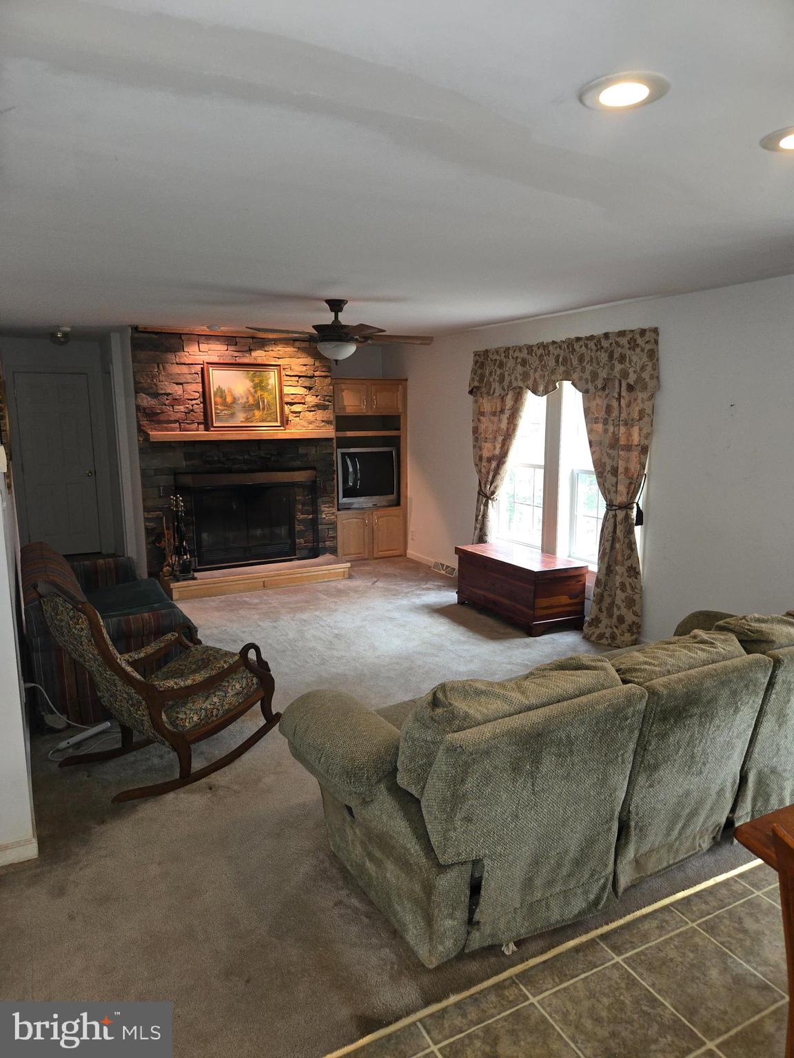 30921 Johnson Road Salisbury, MD 21804 - Photo 2 of 11 a living room with furniture and a flat screen tv