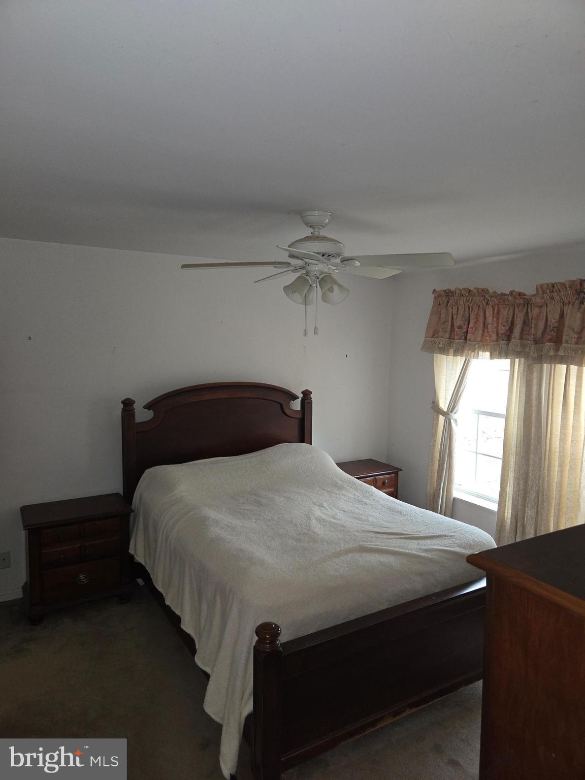 30921 Johnson Road Salisbury, MD 21804 - Photo 6 of 11 a bedroom with a bed and window