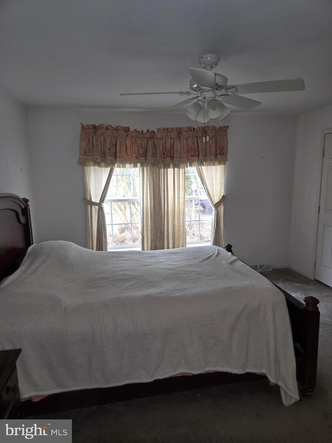 30921 Johnson Road Salisbury, MD 21804 - Photo 7 of 11 a bedroom with a bed and window