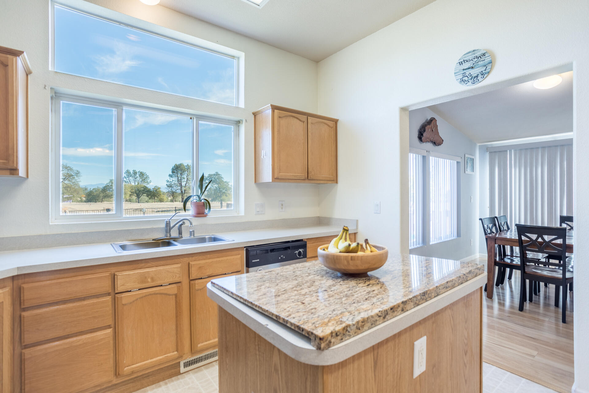 11541 Homestead Lane Redding, CA 96003 - Photo 11 of 51 a kitchen with stainless steel appliances granite countertop a sink a counter space and a window