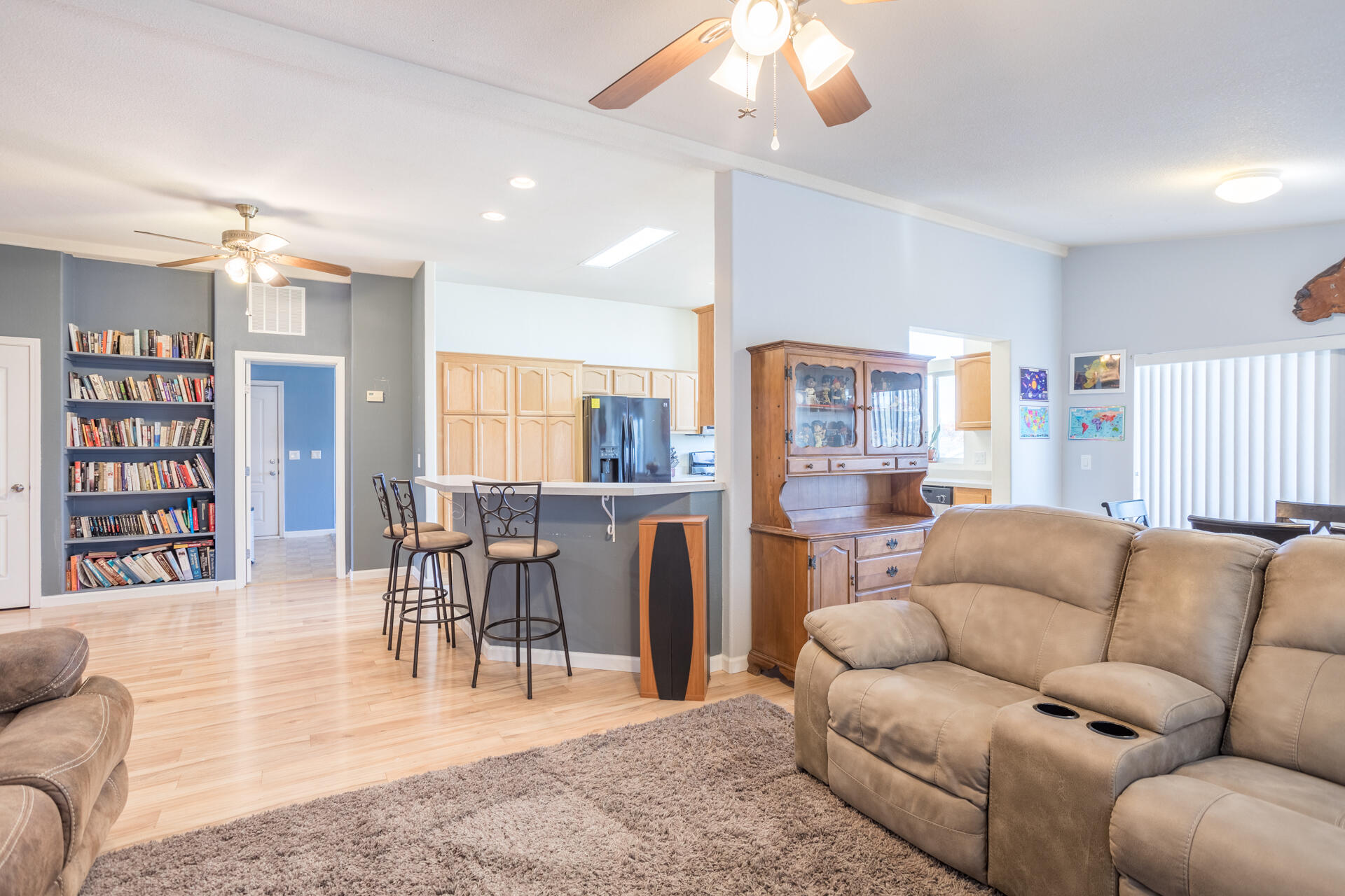 11541 Homestead Lane Redding, CA 96003 - Photo 13 of 51 a living room with furniture and a book shelf