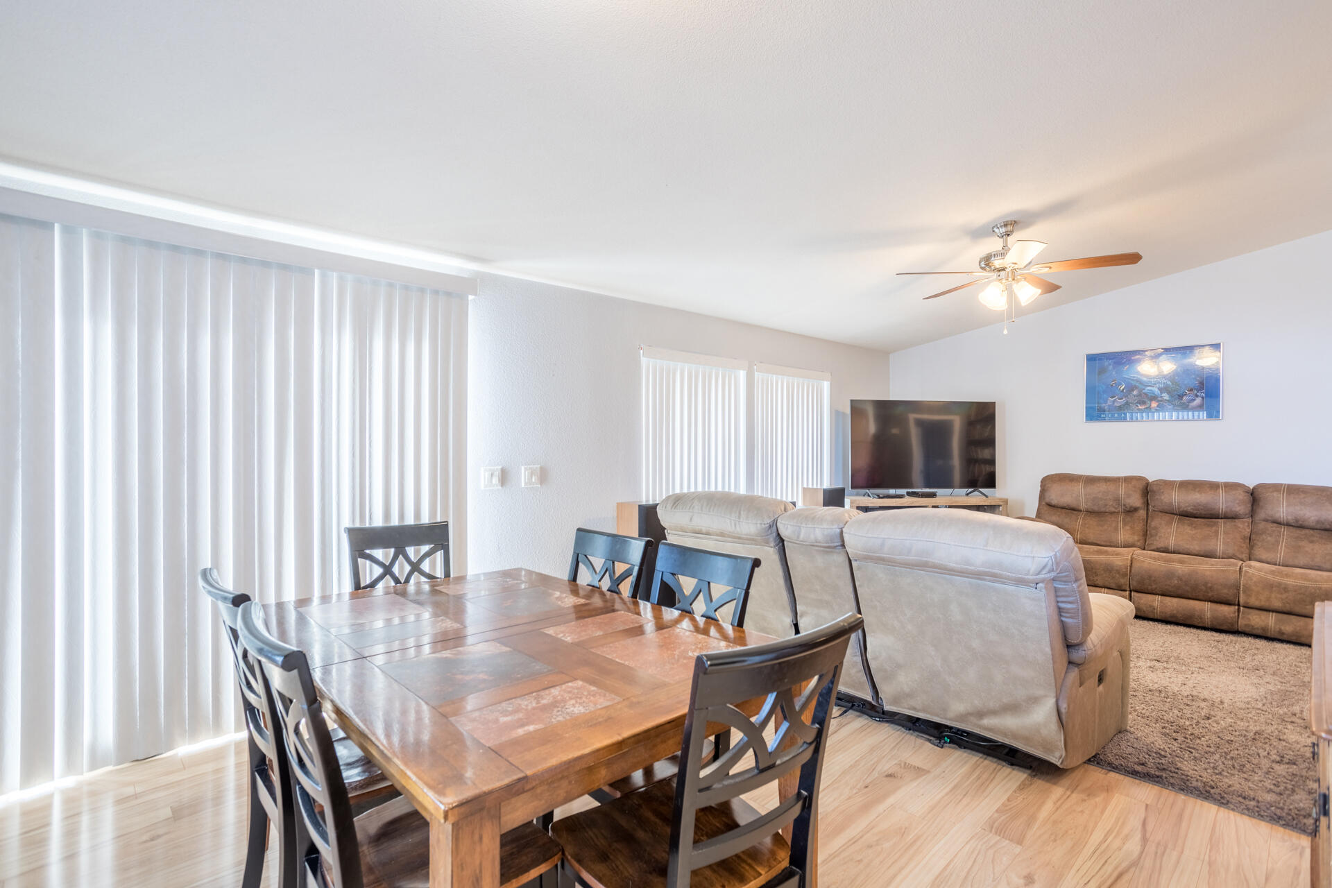 11541 Homestead Lane Redding, CA 96003 - Photo 15 of 51 a living room with furniture a large window and a flat screen tv