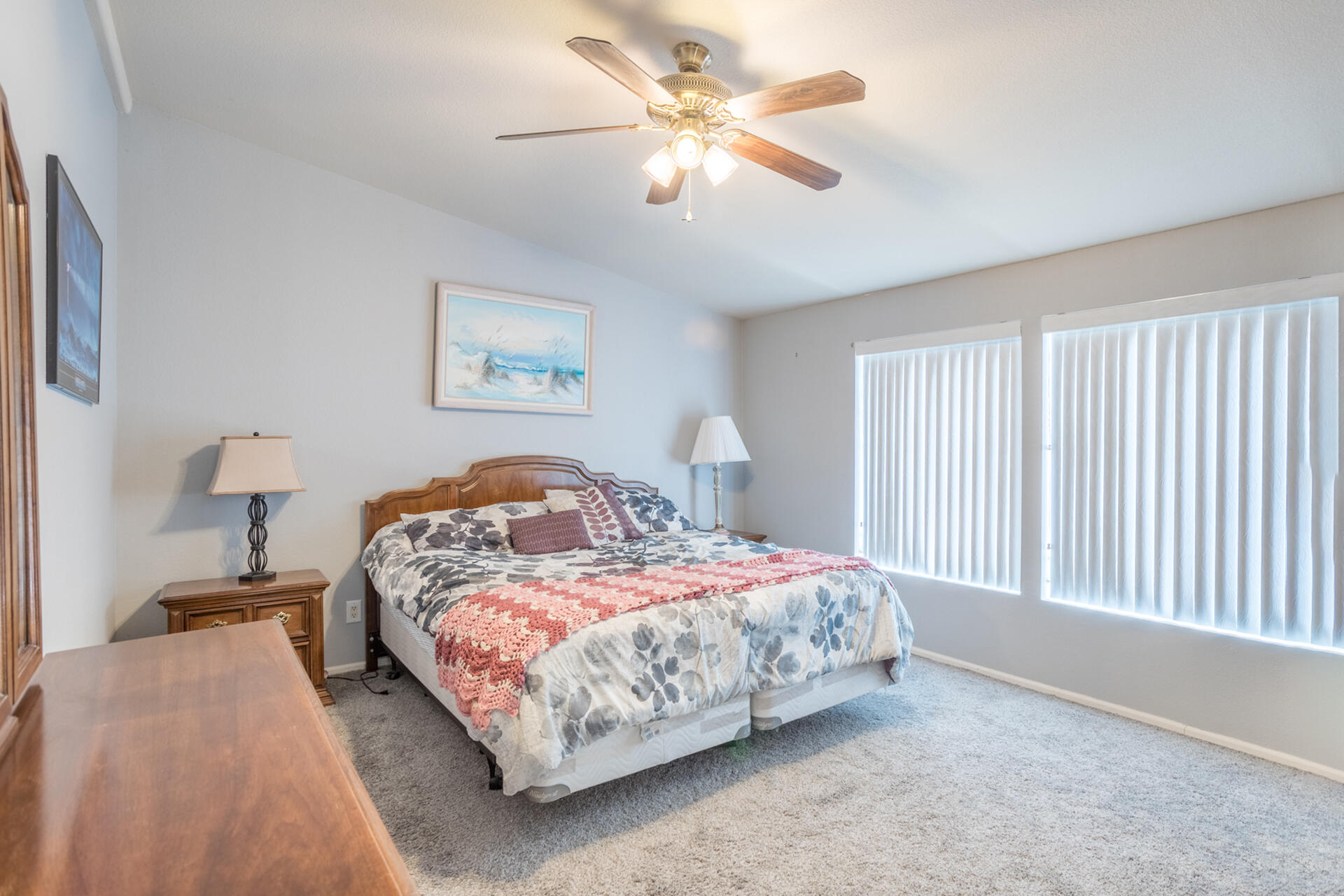 11541 Homestead Lane Redding, CA 96003 - Photo 16 of 51 a bedroom with a bed and a chandelier