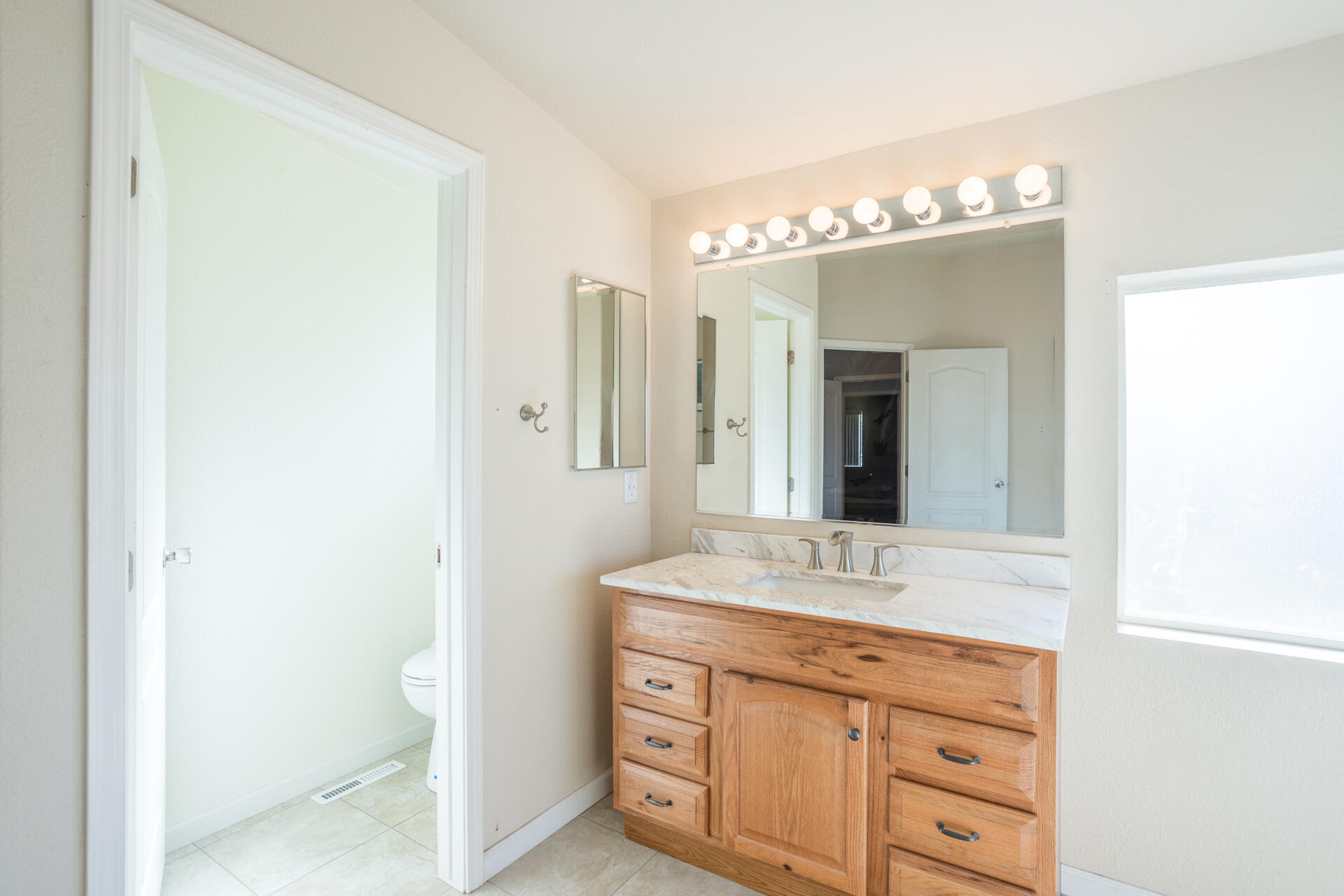 11541 Homestead Lane Redding, CA 96003 - Photo 17 of 51 a bathroom with a sink and a mirror