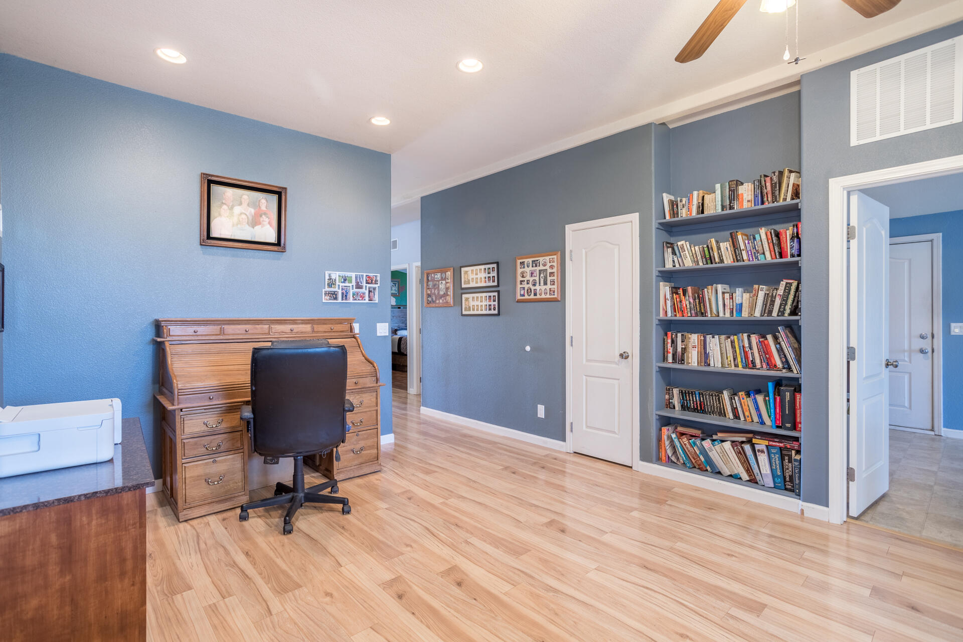 11541 Homestead Lane Redding, CA 96003 - Photo 19 of 51 a view of a workspace with furniture and wooden floor