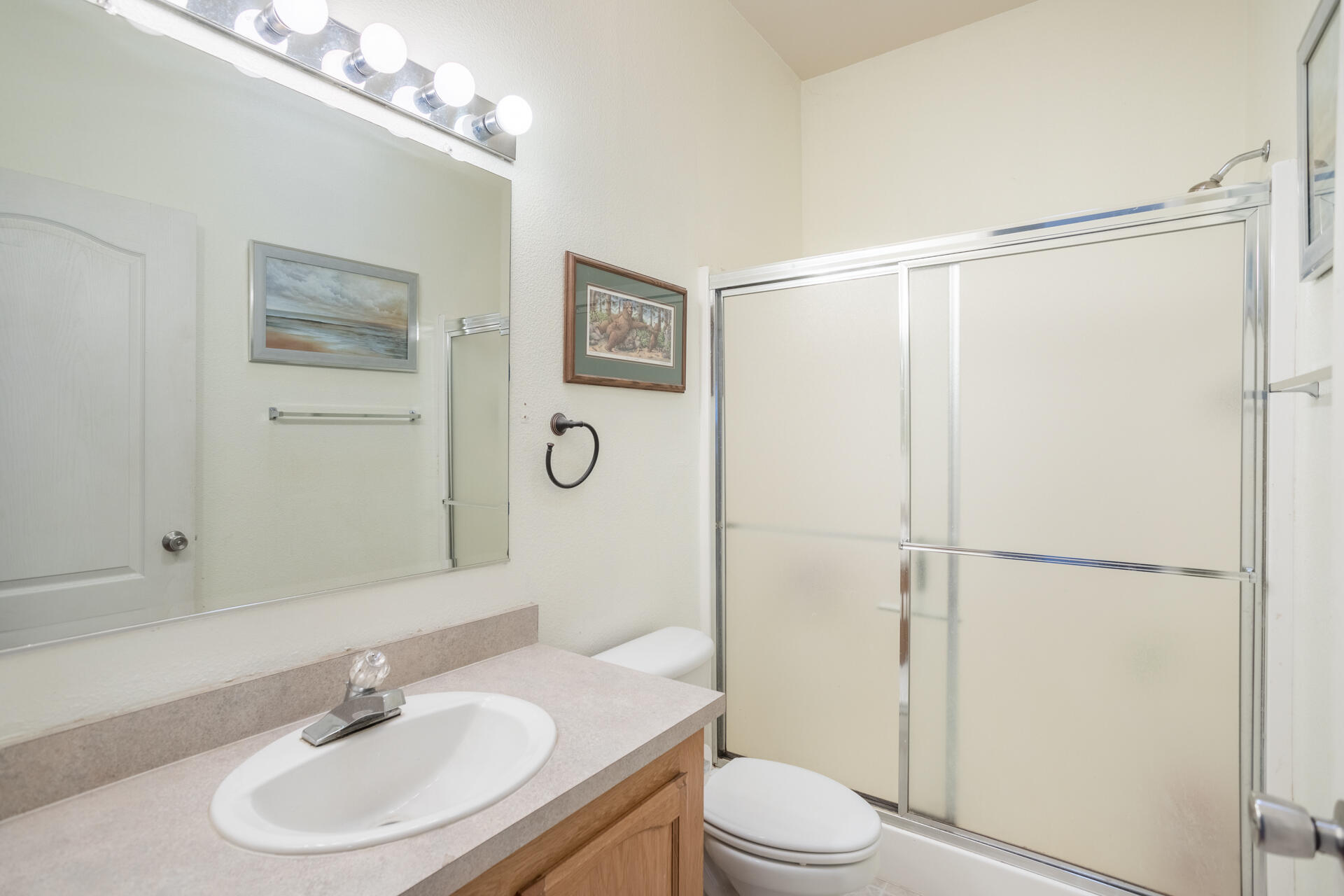 11541 Homestead Lane Redding, CA 96003 - Photo 20 of 51 a bathroom with a sink toilet and shower