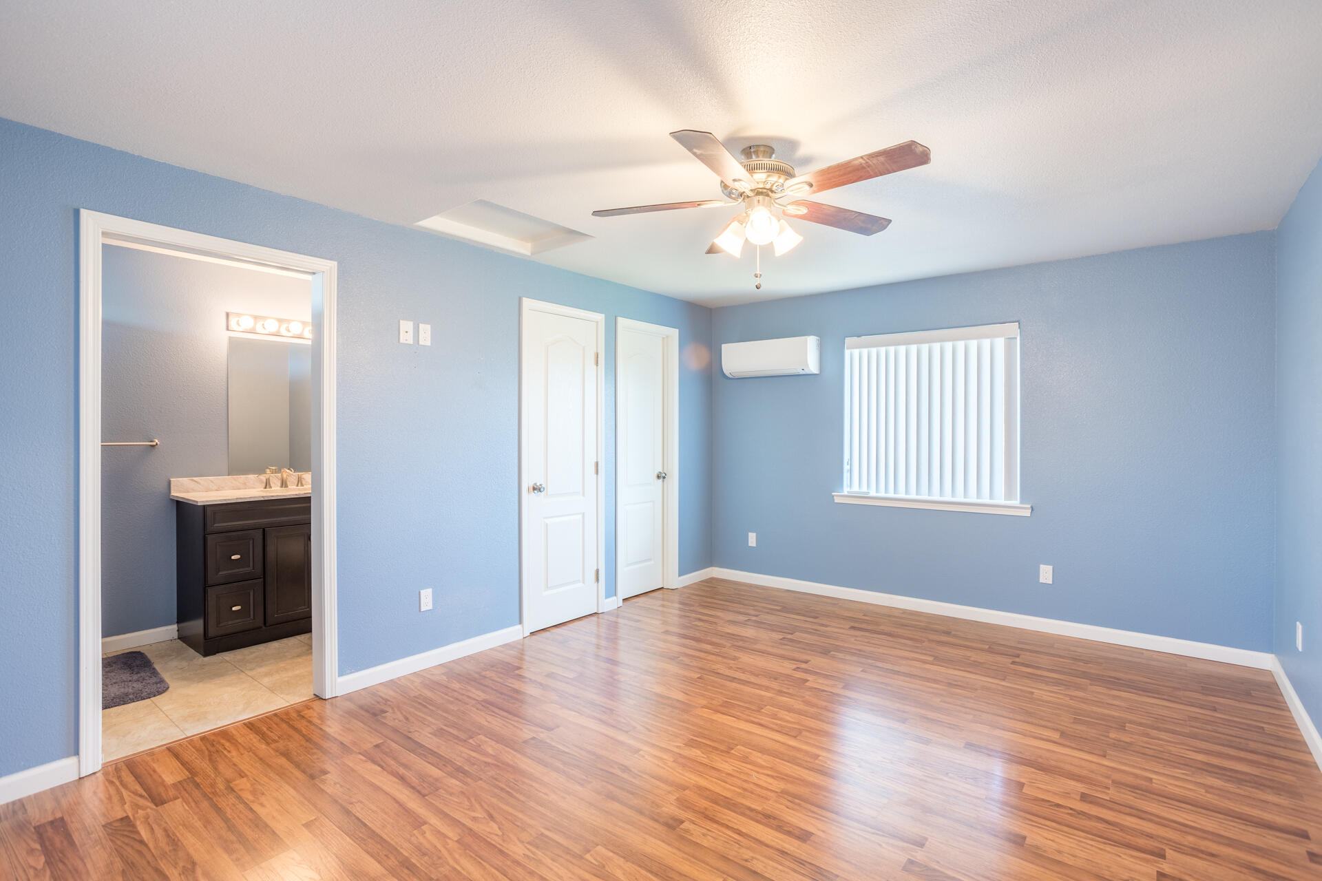 11541 Homestead Lane Redding, CA 96003 - Photo 23 of 51 a view of an empty room with window and wooden floor