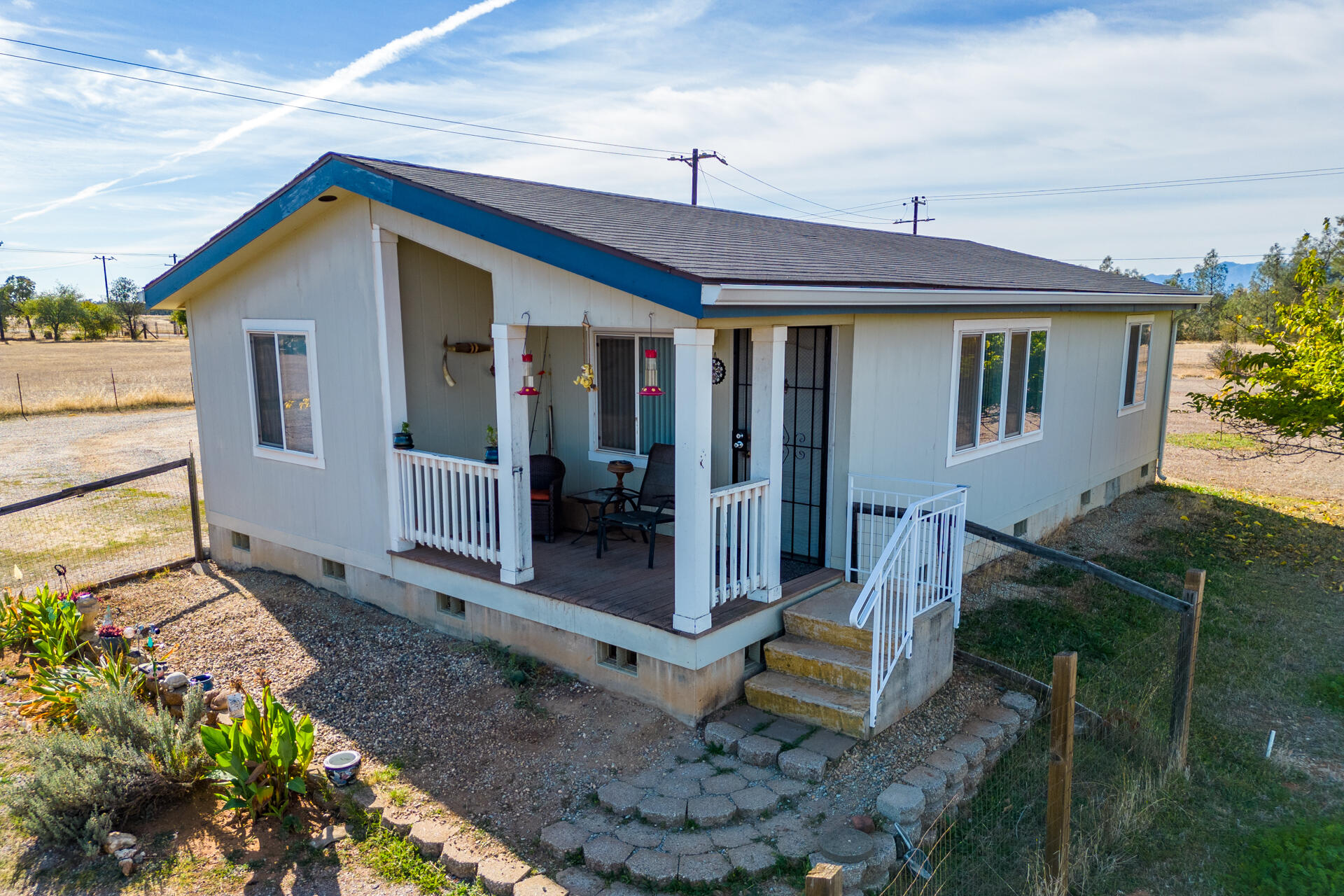 11541 Homestead Lane Redding, CA 96003 - Photo 27 of 51 a front view of a house with garden