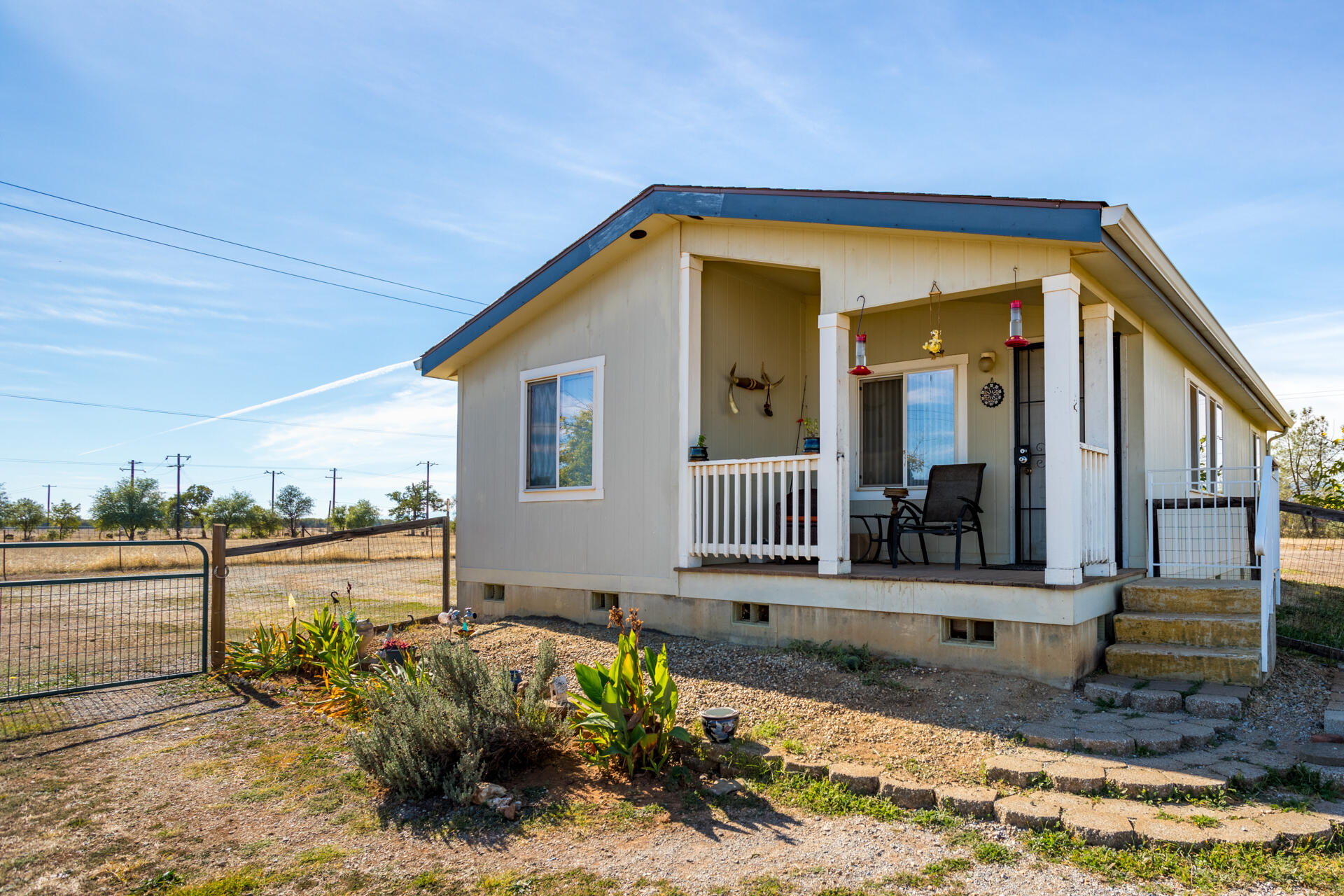 11541 Homestead Lane Redding, CA 96003 - Photo 28 of 51 a front view of a house with garden