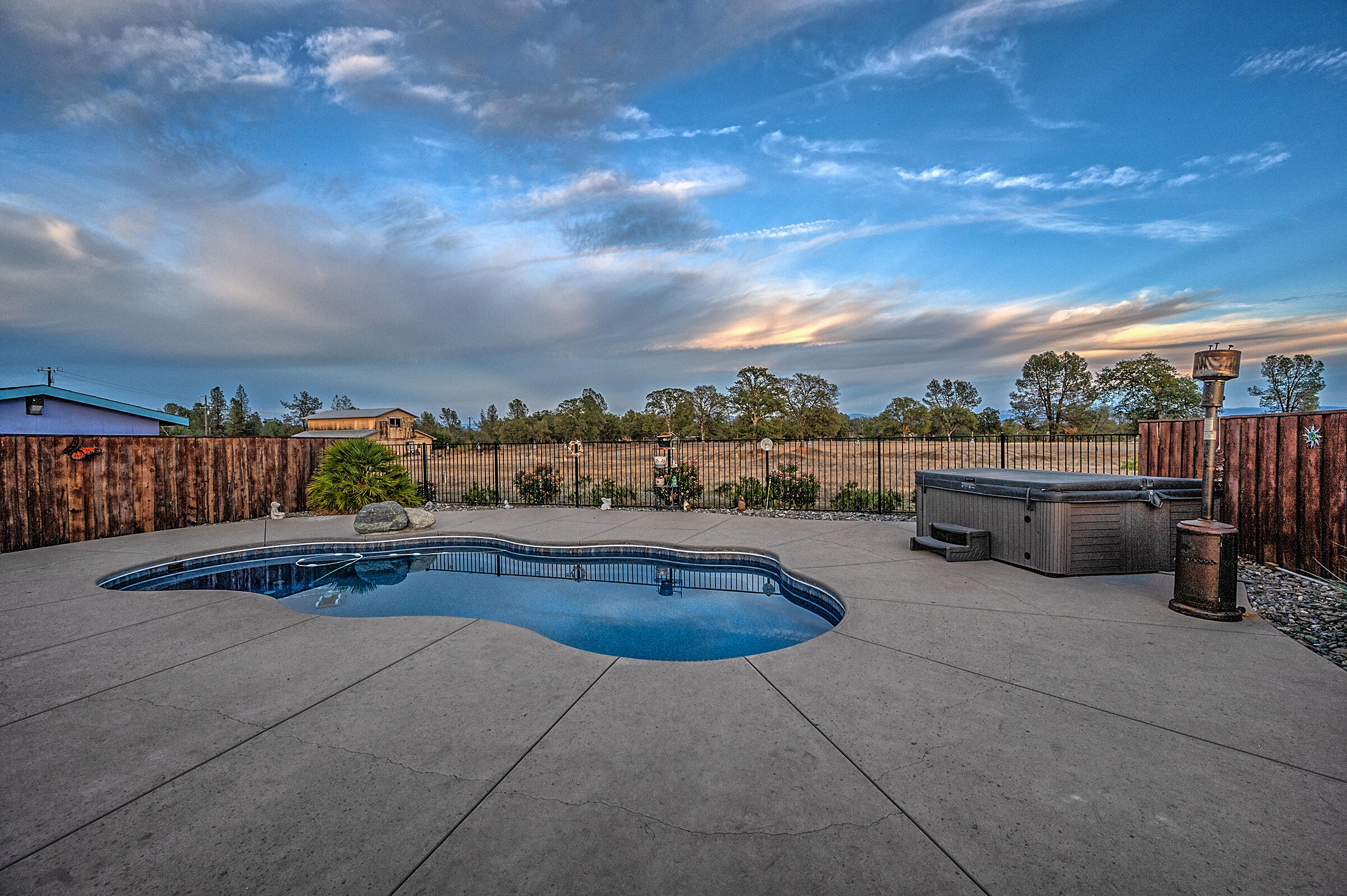 11541 Homestead Lane Redding, CA 96003 - Photo 3 of 51 a view of outdoor space with swimming pool and furniture