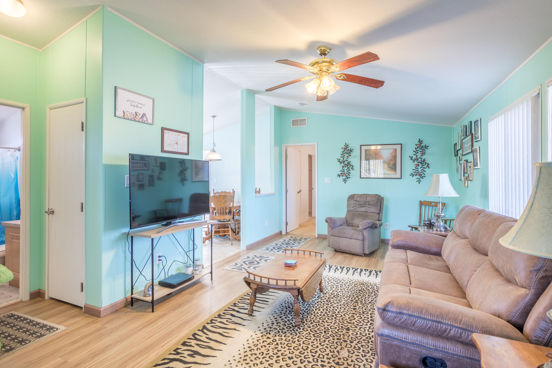 11541 Homestead Lane Redding, CA 96003 - Photo 31 of 51 a living room with furniture and a flat screen tv