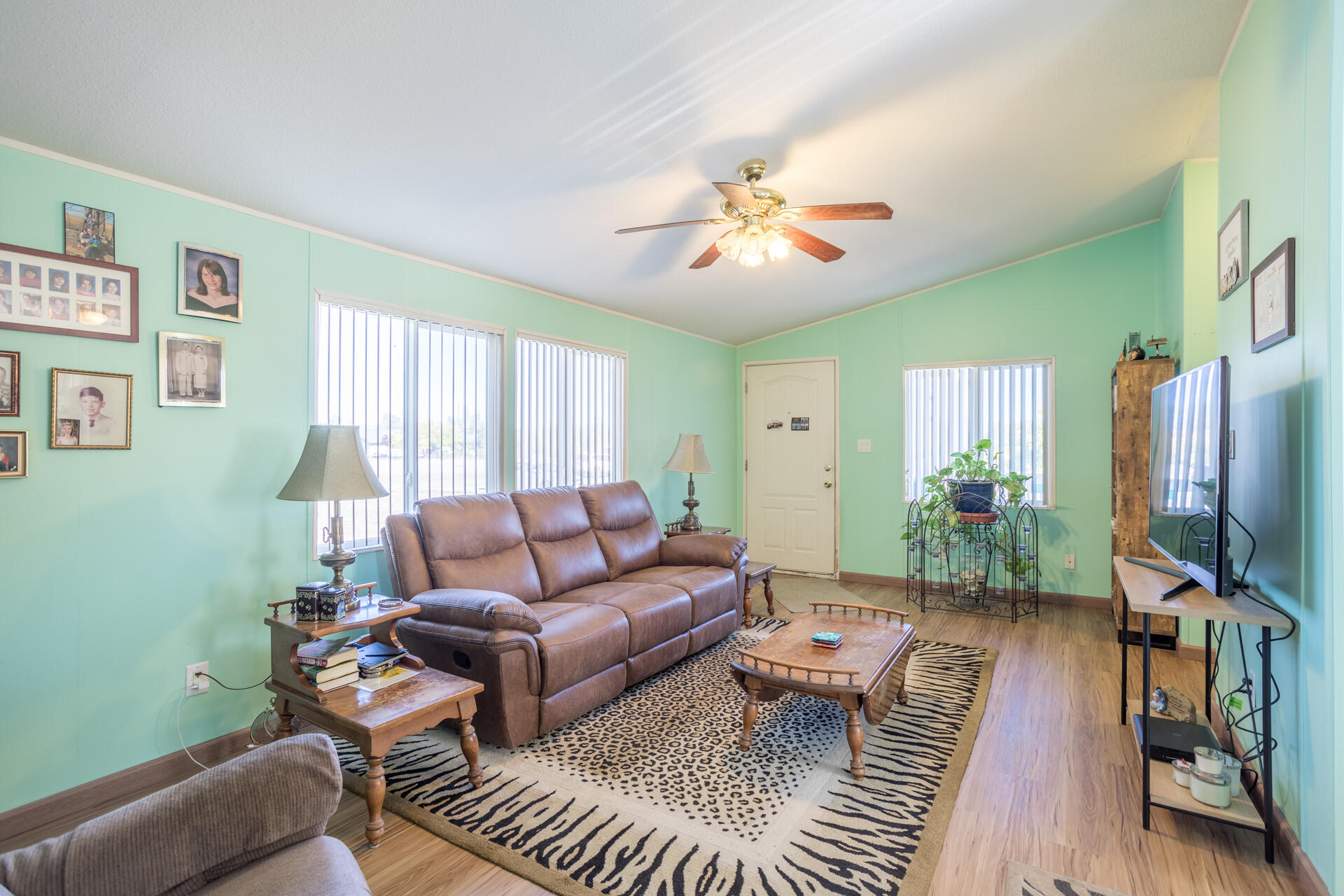 11541 Homestead Lane Redding, CA 96003 - Photo 32 of 51 a living room with furniture a flat screen tv and a window