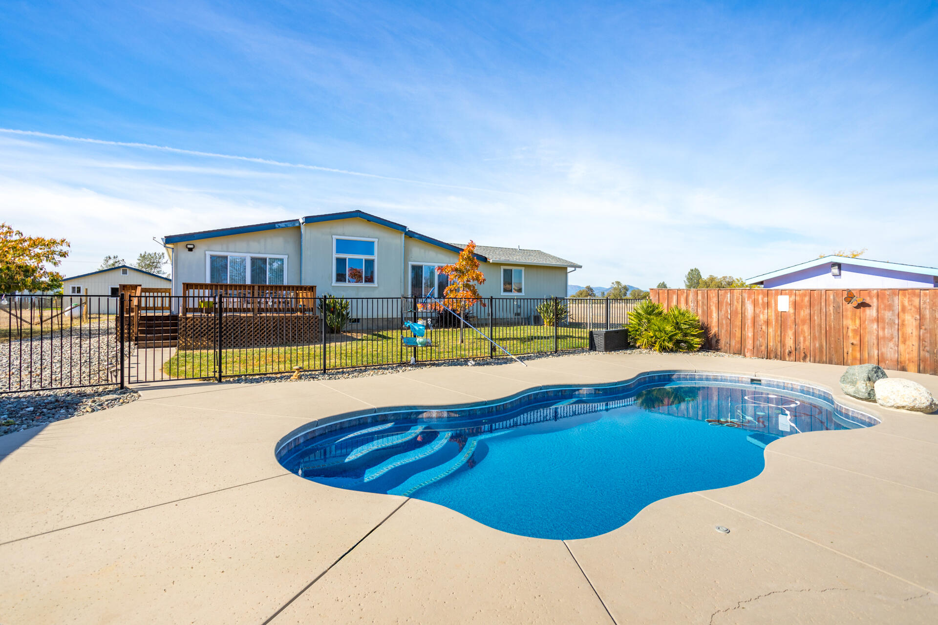 11541 Homestead Lane Redding, CA 96003 - Photo 38 of 51 a view of a swimming pool with a patio