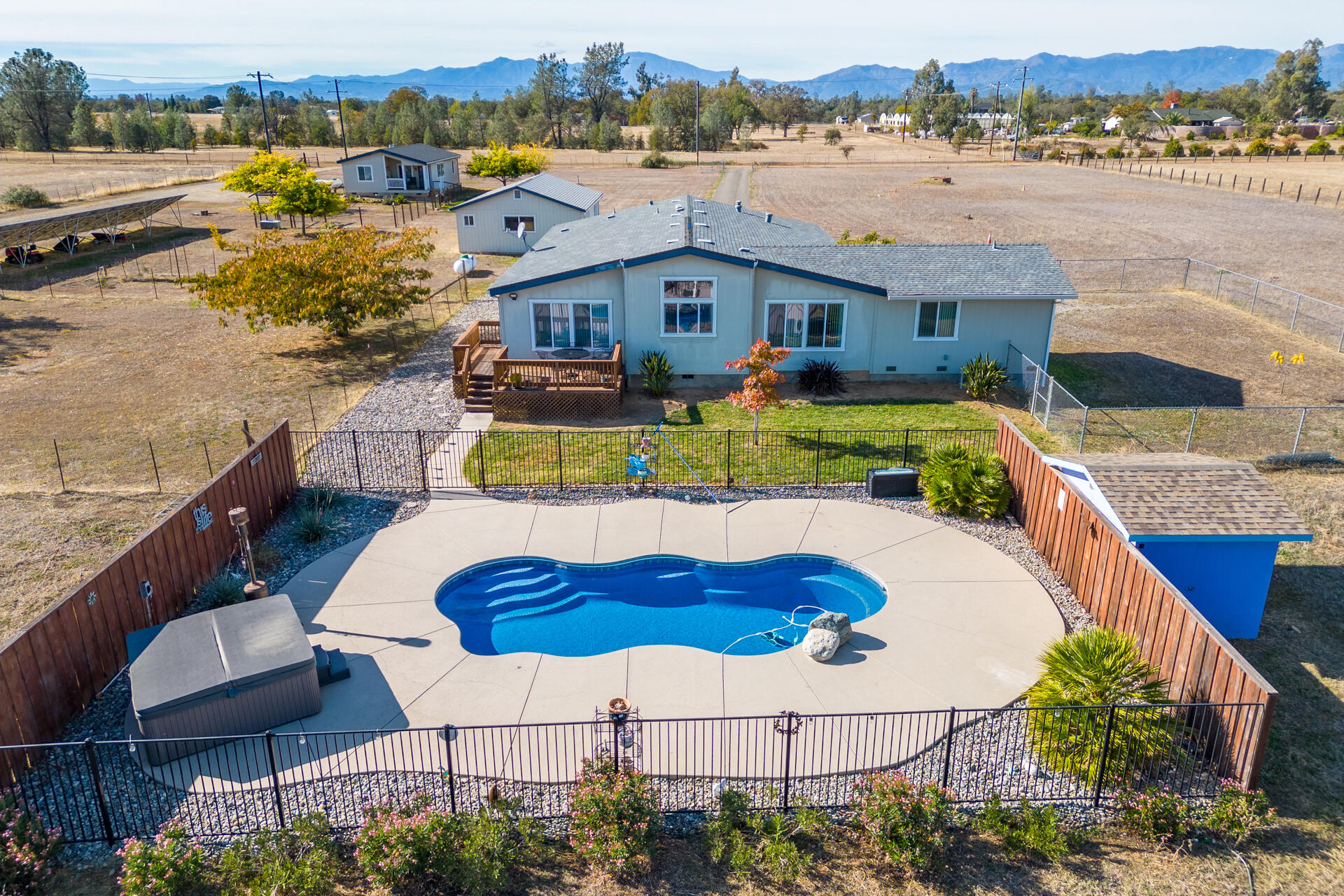 11541 Homestead Lane Redding, CA 96003 - Photo 43 of 51 a aerial view of a house with swimming pool and a yard