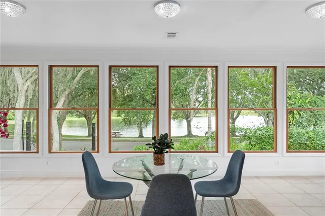 a dining room with furniture and windows