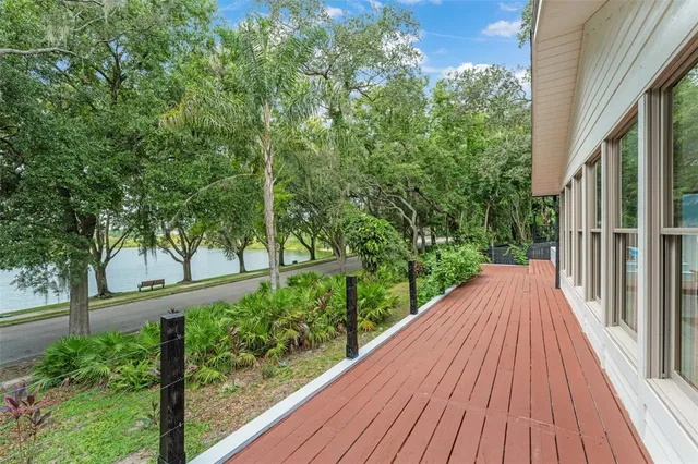 a view of balcony with wooden floor
