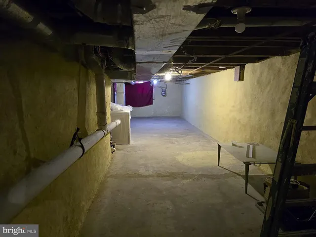 a view of a house with brick walls