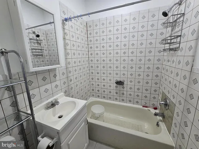 a bathroom with a tub and shower